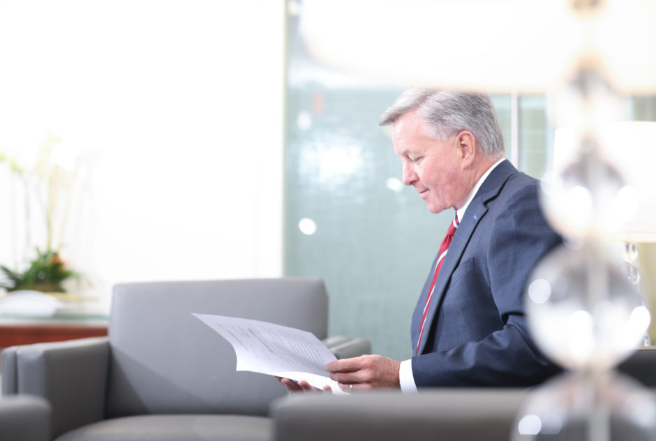 Attorney Thomas McCally reviewing documents.