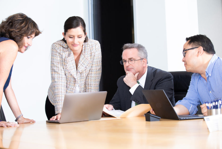 A group of the Carr Maloney attorneys working together on a case.